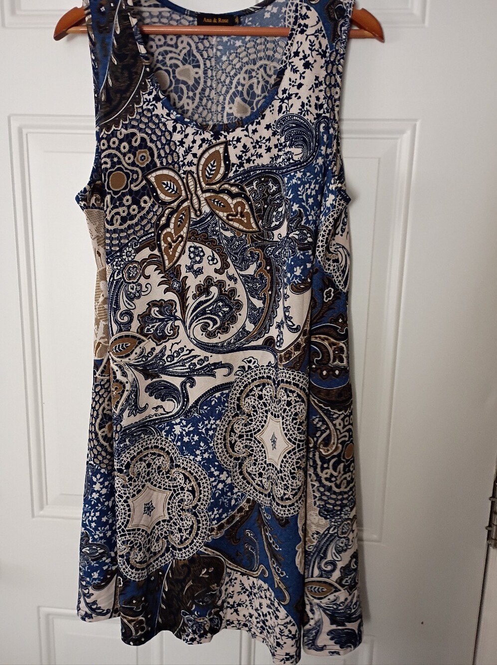 Blue & Cream Paisley Tank Dress. 95% Polyester And 5% Spandex.